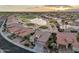 Beautiful aerial view of a house with a golf course and lake in the community at 2722 N 155Th Dr, Goodyear, AZ 85395