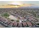 Gorgeous aerial view of a neighborhood with golf course, lake, desert landscaping and mountain views in the background at 2722 N 155Th Dr, Goodyear, AZ 85395