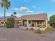 Backyard with covered patio, BBQ, desert landscaping and palm trees at 2722 N 155Th Dr, Goodyear, AZ 85395