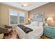 Inviting bedroom with neutral walls, hardwood floors, windows with shutters, and ceiling fan at 2722 N 155Th Dr, Goodyear, AZ 85395