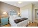Comfortable bedroom features hardwood floors, ceiling fan, and a closet at 2722 N 155Th Dr, Goodyear, AZ 85395