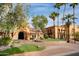 Mediterranean-style home with grand entrance, mature trees and lush landscaping at 2722 N 155Th Dr, Goodyear, AZ 85395