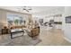 Spacious living room with bar seating and great natural light adjoining modern kitchen at 2722 N 155Th Dr, Goodyear, AZ 85395