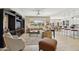 Bright and open living room with large windows, neutral colors, and a ceiling fan at 2722 N 155Th Dr, Goodyear, AZ 85395
