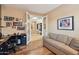 Spacious office features hardwood floors, natural light, and a view of the home's entry at 2722 N 155Th Dr, Goodyear, AZ 85395