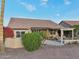 Inviting covered patio area features dining and lounging furniture, great for outdoor enjoyment at 2722 N 155Th Dr, Goodyear, AZ 85395