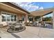 Covered patio area with outdoor seating and BBQ at 2722 N 155Th Dr, Goodyear, AZ 85395