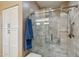 Shower with glass door and stone tile with a built-in niche at 2722 N 155Th Dr, Goodyear, AZ 85395