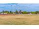 Exterior shot of a baseball field with players and trees in the background at 313 E Westchester Dr, Tempe, AZ 85283