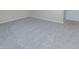Cozy bedroom featuring neutral carpet, base molding and a door at 313 E Westchester Dr, Tempe, AZ 85283