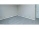 A bedroom painted in neutral colors featuring grey carpeting and base molding at 313 E Westchester Dr, Tempe, AZ 85283