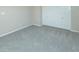 Bedroom features neutral walls, grey carpet, white trim and double door closet at 313 E Westchester Dr, Tempe, AZ 85283