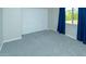 Bright bedroom features neutral walls, grey carpet, white trim and double door closet at 313 E Westchester Dr, Tempe, AZ 85283