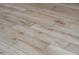 A detailed shot of the kitchen floors, showcasing the wood-look porcelain tile planks at 313 E Westchester Dr, Tempe, AZ 85283