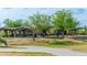Outdoor picnic area with covered tables, mature trees, and walking path at 313 E Westchester Dr, Tempe, AZ 85283