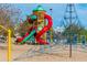 A vibrant playground with climbing structures, slides, and playground signage at 313 E Westchester Dr, Tempe, AZ 85283