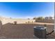 Picture of a private backyard, desert landscaping, block fence, and air conditioner unit at 3165 N 306Th Ln, Buckeye, AZ 85396