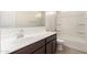 Bathroom vanity with modern sink, next to a shower-tub combination at 3165 N 306Th Ln, Buckeye, AZ 85396