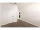 Bedroom with carpet, closet, and a view into a well-lit kitchen at 3165 N 306Th Ln, Buckeye, AZ 85396