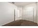 Bedroom featuring a closet with sliding doors and a view into another room at 3165 N 306Th Ln, Buckeye, AZ 85396