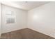 Sunlit bedroom with plush carpeting and double electrical outlets at 3165 N 306Th Ln, Buckeye, AZ 85396