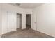 Bedroom with carpet, closet, and passage to another room at 3165 N 306Th Ln, Buckeye, AZ 85396