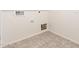 A utility room with tile flooring, connections for a washer and dryer and other utilities at 3165 N 306Th Ln, Buckeye, AZ 85396