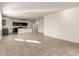 Open concept living room and kitchen with tile flooring and abundant natural light at 3165 N 306Th Ln, Buckeye, AZ 85396