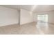 Spacious living room with tile flooring and a sliding glass door, ready for personalized touches and decor at 3165 N 306Th Ln, Buckeye, AZ 85396