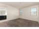 Spacious main bedroom featuring carpet flooring and an ensuite bathroom at 3165 N 306Th Ln, Buckeye, AZ 85396