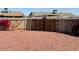 Backyard gate with rock landscaping and tall privacy fence at 3242 W Christy Dr, Phoenix, AZ 85029