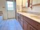 Bathroom has tiled floors, dual sinks, and a walk out door at 3242 W Christy Dr, Phoenix, AZ 85029