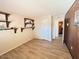 Bedroom featuring wood-like floors, a built-in shelving unit and a closet at 3242 W Christy Dr, Phoenix, AZ 85029