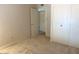 Bedroom featuring carpeted floors, closet, and an open doorway at 3242 W Christy Dr, Phoenix, AZ 85029