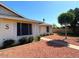 Exterior view showcasing the home's architectural details, desert landscaping, and mature shade tree at 3242 W Christy Dr, Phoenix, AZ 85029