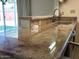Close-up of the kitchen counter, showcasing the elegant marble countertop and modern faucet at 3242 W Christy Dr, Phoenix, AZ 85029