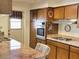 Traditional kitchen featuring wood cabinets, built-in appliances, and a marble countertop at 3242 W Christy Dr, Phoenix, AZ 85029