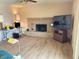 Living room with laminate wood flooring and fireplace at 3242 W Christy Dr, Phoenix, AZ 85029