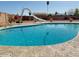 Backyard featuring a large pool, a slide, and desert landscaping at 3242 W Christy Dr, Phoenix, AZ 85029