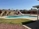 Backyard pool with slide, patio space, and desert landscaping at 3242 W Christy Dr, Phoenix, AZ 85029