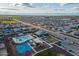 An aerial view of the neighborhood featuring a community center with a pool, playground, and a basketball court at 4140 E Caitlin Dr, San Tan Valley, AZ 85140