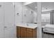 Bathroom features a wood vanity and white walls with a large mirror at 4140 E Caitlin Dr, San Tan Valley, AZ 85140