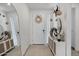 Bright entryway featuring a white door, stylish decor, and a decorative cabinet, creating a welcoming ambiance at 4140 E Caitlin Dr, San Tan Valley, AZ 85140