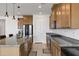 A gourmet kitchen features granite countertops, stainless steel appliances, and modern cabinetry at 4140 E Caitlin Dr, San Tan Valley, AZ 85140
