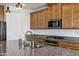 The kitchen features granite countertops, stainless steel appliances, and an undermount sink at 4140 E Caitlin Dr, San Tan Valley, AZ 85140