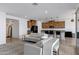 Spacious open-concept living room with modern furniture, sleek floors, and a view into the kitchen at 4140 E Caitlin Dr, San Tan Valley, AZ 85140