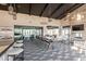 Stylish lounge area featuring a bar, dining table, fireplace, and comfortable couches at 4140 E Caitlin Dr, San Tan Valley, AZ 85140