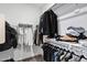 Walk-in closet features rods, shelving, and ample storage space at 4140 E Caitlin Dr, San Tan Valley, AZ 85140