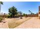 Large backyard with a fire pit, water feature, and ample space at 4305 E Cherokee St, Phoenix, AZ 85044