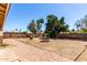 Backyard featuring a brick-lined walkway and mature trees at 4305 E Cherokee St, Phoenix, AZ 85044